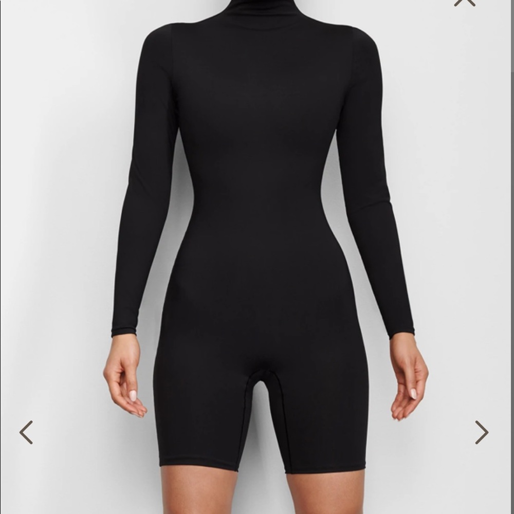 Skims ALL-IN-ONE LONG SLEEVE MID THIGH ONESIE